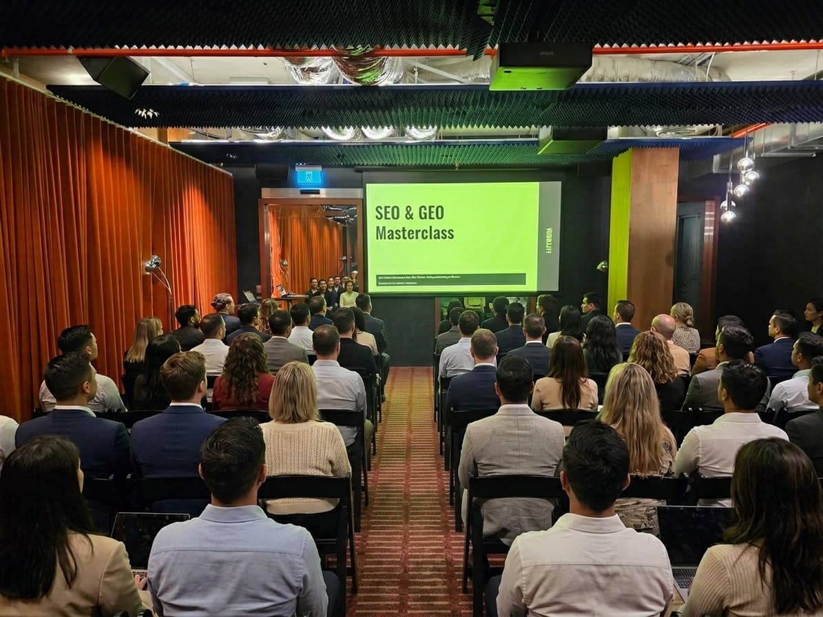 Audience seated for an SEO and GEO masterclass presentation.