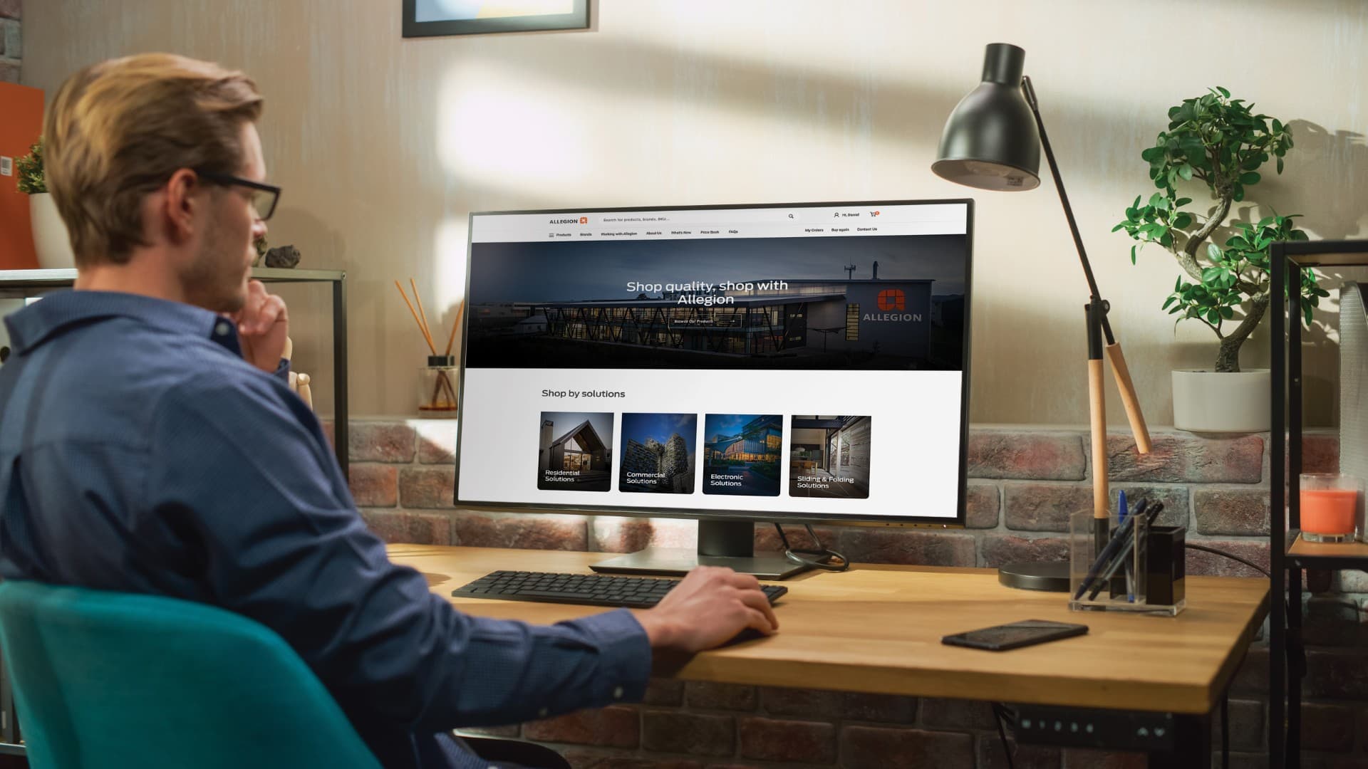 Allegion AlleShop trade portal shown on a desktop monitor